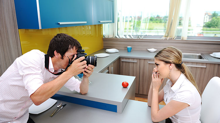 Photographer taking photo of girl